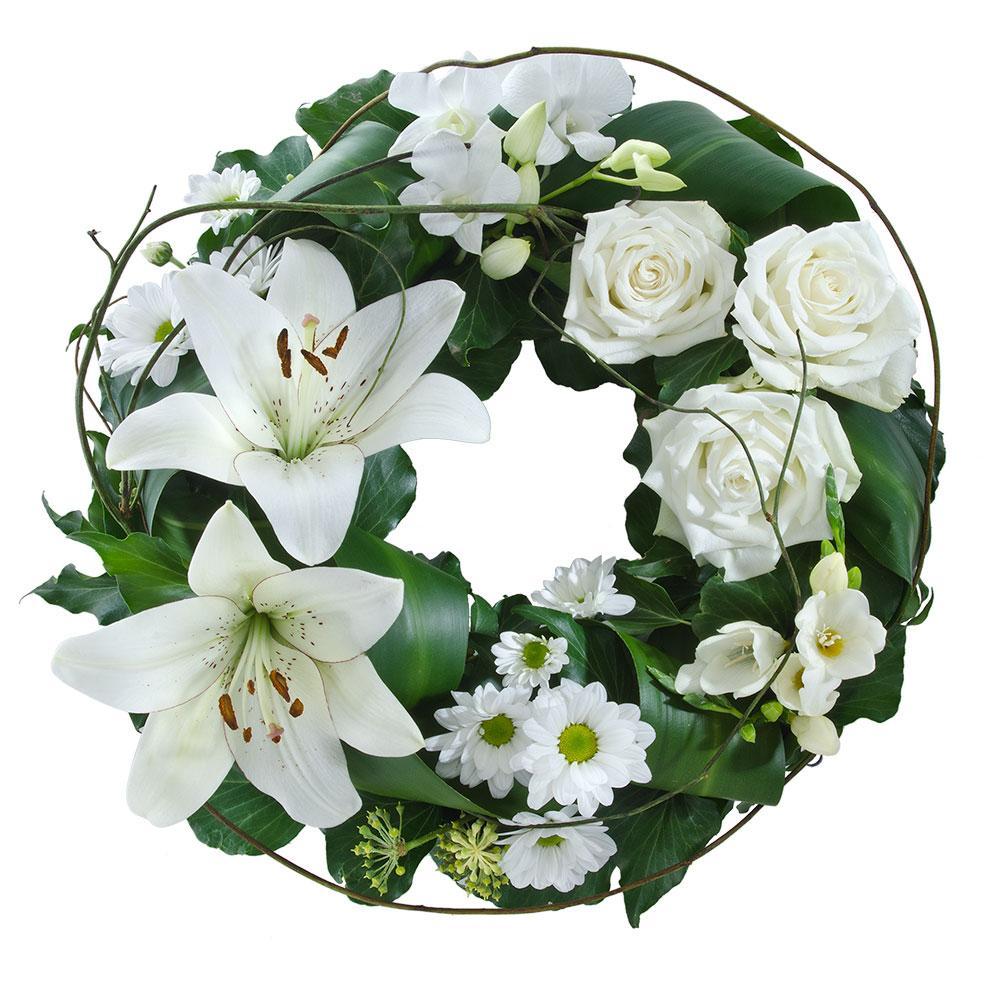 Mixed White Floral Wreath
This floral wreath features beautiful blooms in tasteful white with lush green foliage. Suitable for delivery to service only (not suitable for delivery to home).
Flowers may vary from the image displayed due to seasonal availability. We'll craft an arrangement which is similar in style using seasonal flowers that is equal or greater in value.
